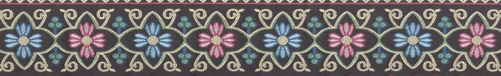Jacquard woven ribbon with floral motifs in pink, blue, and cream on a dark ground